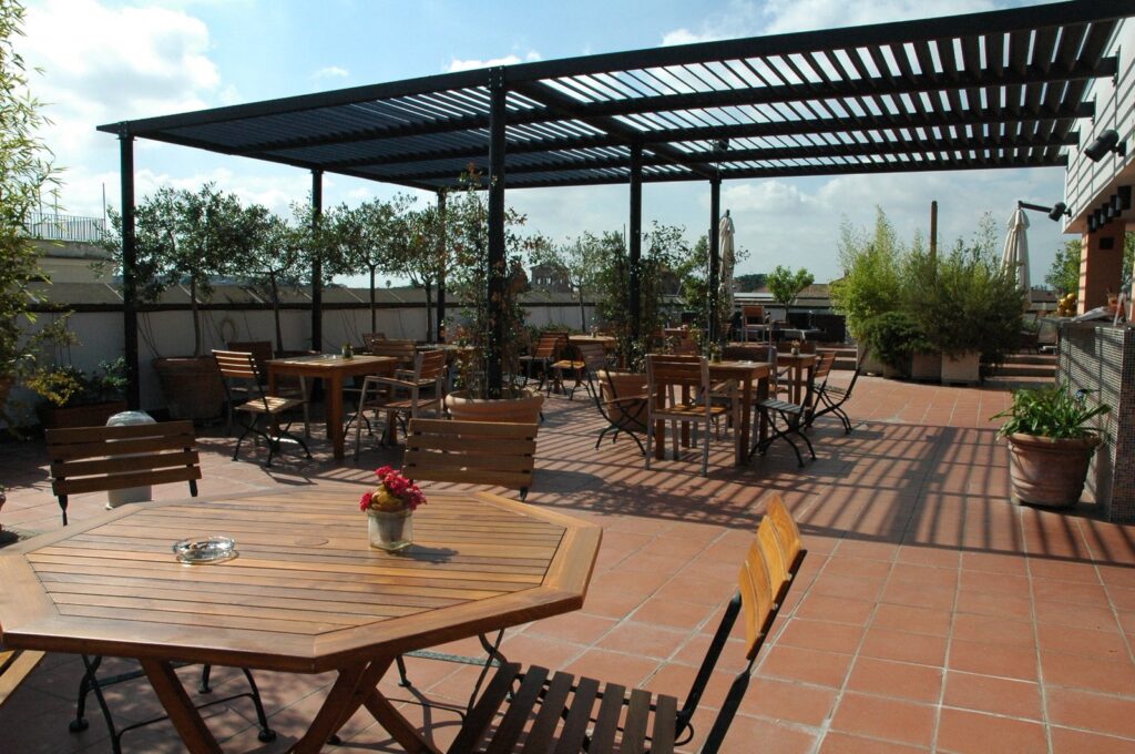 A louvered pergola on an empty al-fresco restaurant