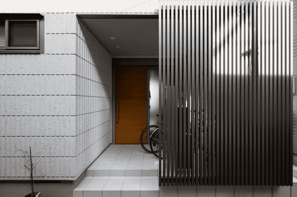 outdoor privacy screen partially covers an apartment front porch