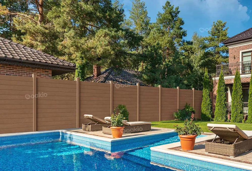 a swimming pool with oakio wpc fencing