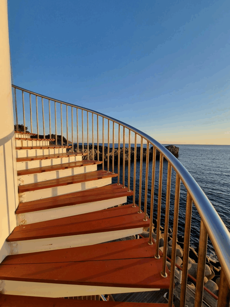 spiral stairs composite deck handrail ocean sunset