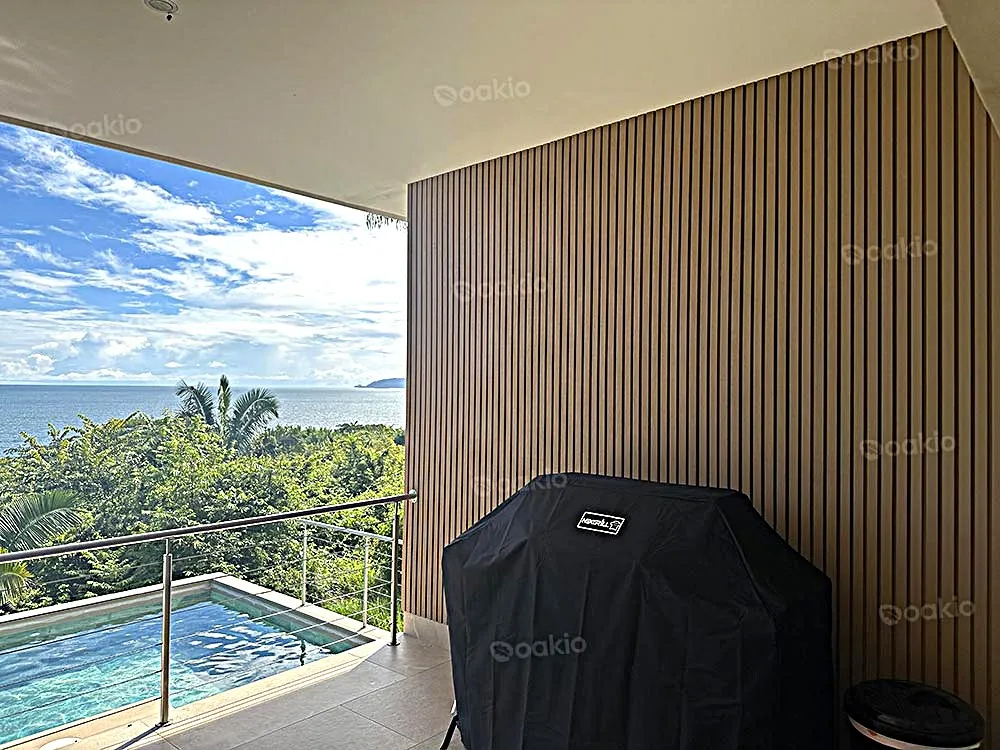 balcony wall with oakio wpc cladding overlooking pool