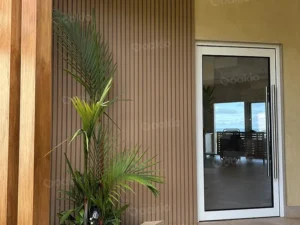 entrance wall with oakio wpc panels in modern home